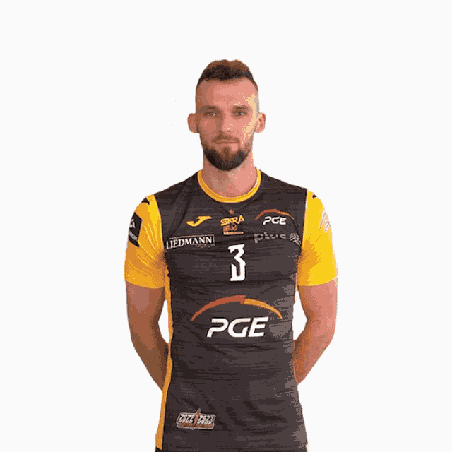 a man is wearing a black and yellow jersey with the number 3 on it