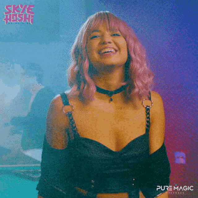 a woman with pink hair is smiling and wearing a choker .