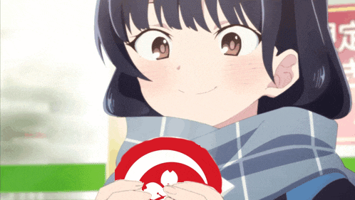a girl with a scarf around her neck is holding a red circle with a white circle in the middle