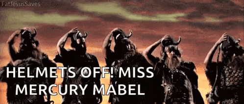 a group of vikings are standing in a line with their helmets off and the words helmets off miss mercury mabel above them .