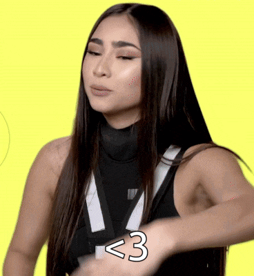 a woman with long hair is wearing a black tank top with the number 3 written on it