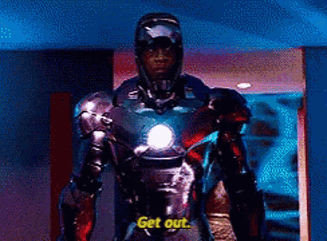 a man in a superhero costume says " get out "