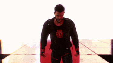 a man wearing a shirt that says " first week fight "