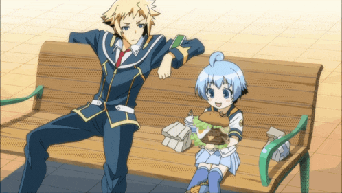 a boy and a girl are sitting on a bench with a girl holding a hamburger