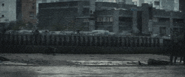 a black and white photo of a body of water surrounded by buildings