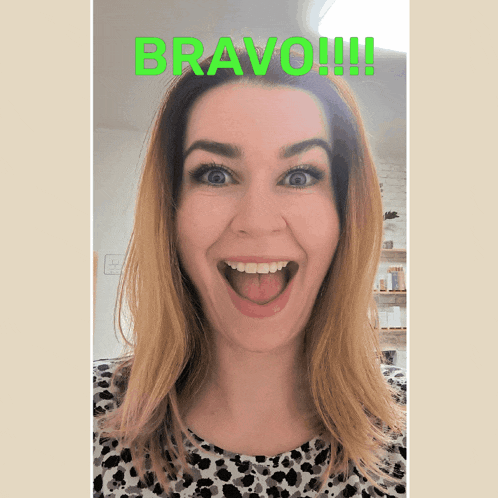 a woman with her tongue out and the word bravo written on her face
