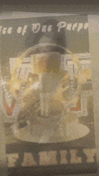 a blurred image of a person holding a cup of coffee with the words " family " on the bottom