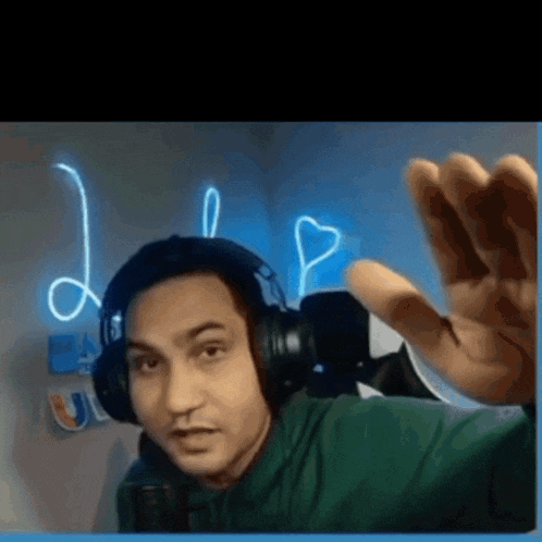 a man wearing headphones is making a funny face .