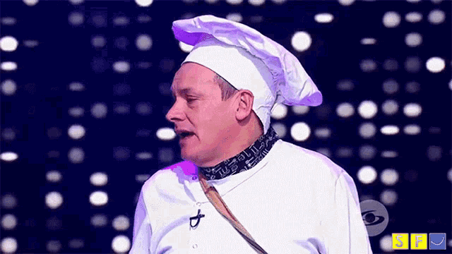 a man in a chef 's hat stands in front of a blue and yellow sign that says sfr