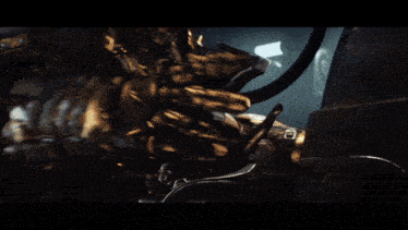a large robot with horns is standing in a dark hallway