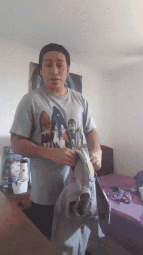 a man wearing a t-shirt that says ' a ' on it