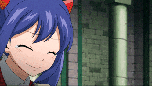 wendy from fairy tail smiles with her eyes closed in front of a brick wall