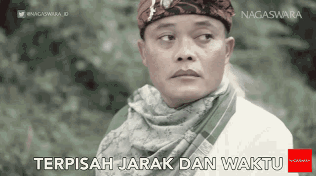 a man with a scarf around his neck and the words terpisah jarak dan waktu written below him