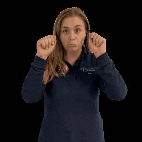 a woman wearing a blue shirt that says greater boston college on it