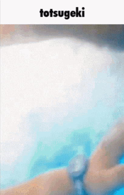 a person is swimming in a pool with the words totsugeki on the bottom