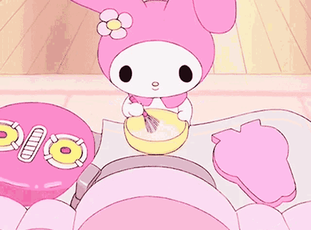 a pink bunny with a flower on her head is mixing something