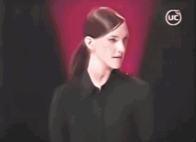 a woman in a black shirt with a uc logo on the bottom