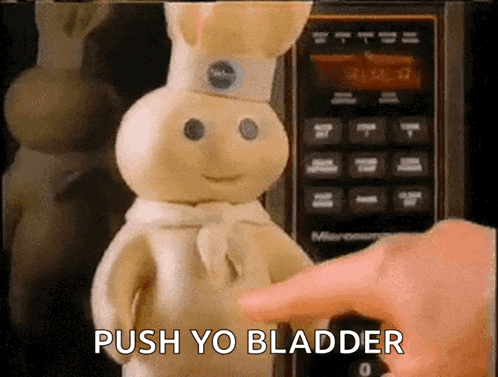 a pillsbury dough boy is being pushed into a microwave