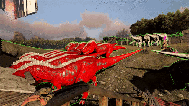 a bunch of red dinosaurs are laying on the ground