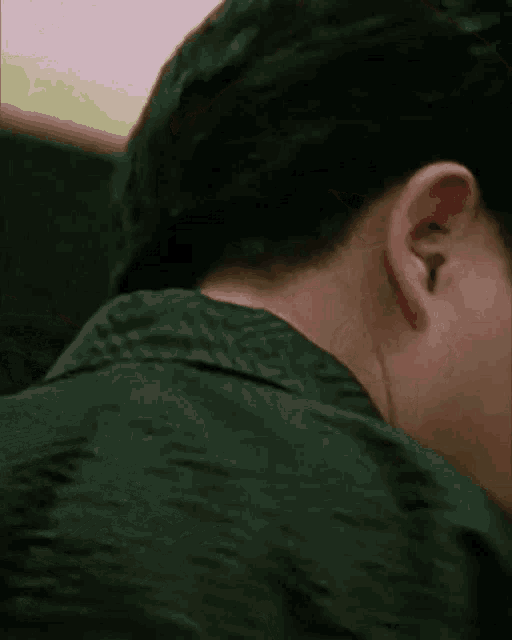 a close up of a person 's ear and neck