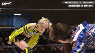 two women are wrestling in a ring with tjpw written on the bottom of the screen