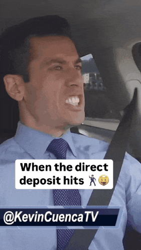 a man in a blue shirt and tie is sitting in a car
