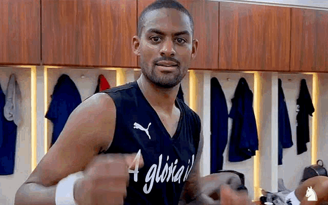 a basketball player wearing a jersey that says gloria