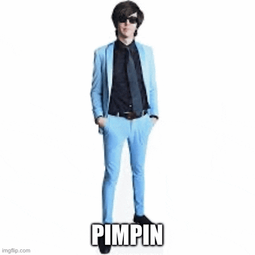 a man in a blue suit and black tie is laying down with the word pimpin above him .