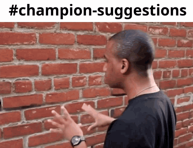 a man standing in front of a brick wall with # champion-suggestions written on the bottom
