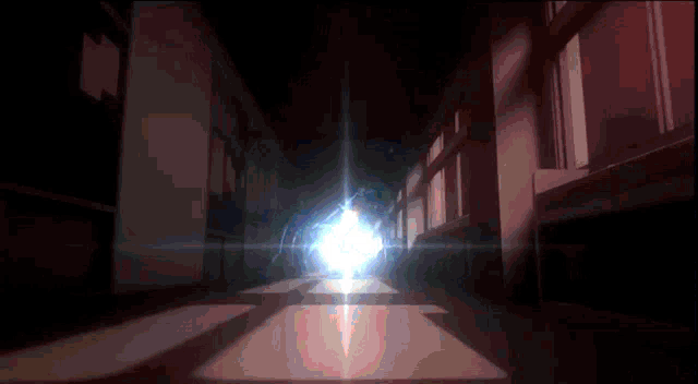 a dark hallway with a bright light at the end of it