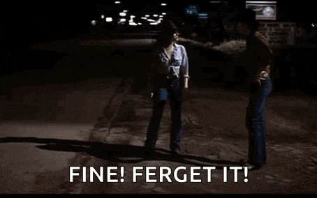 a man in a cowboy hat is standing in front of a gas station and saying `` fine ! forget it ! ''