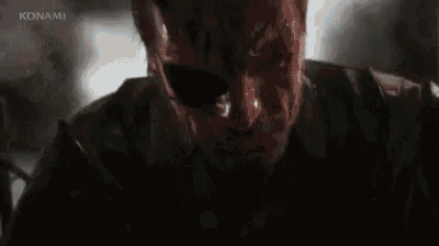 a man with blood on his face is screaming in a dark room .