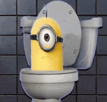 a yellow minion is sitting on a toilet with a sad look on his face