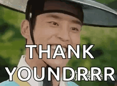 a man wearing a hat is smiling and saying `` thank you , you , rr , rr '' .