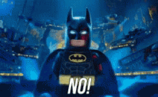 a lego batman says no in a blurry photo .