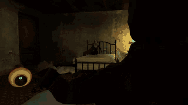 a man is sitting on a couch in a dark room