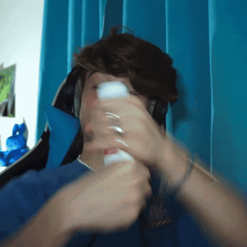 a blurry picture of a person holding a white object