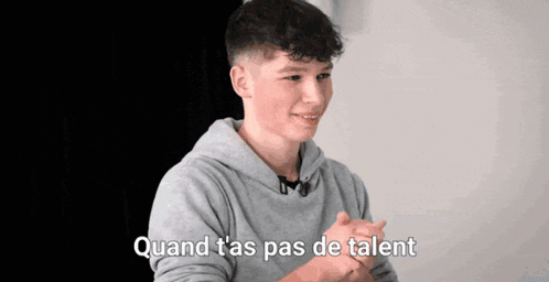 a young man in a grey hoodie says quand t'as pas de talent in french