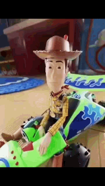 woody from toy story is sitting on top of buzz lightyear 's toy car .
