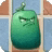 a green cartoon character with a very angry face is sitting on a brick wall .