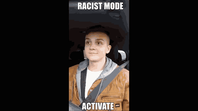 a man wearing sunglasses in a car with the words racist mode activate above him