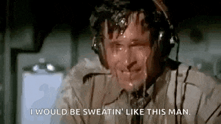 a man wearing headphones is sweating and saying `` i would be sweating like this man '' .