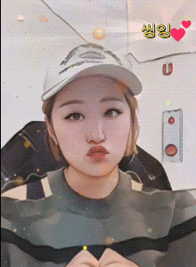 a woman wearing a baseball cap with the letter u on the bottom