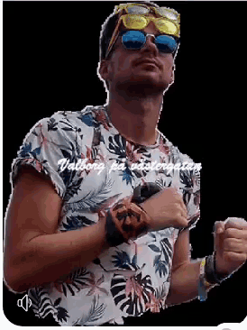 a man wearing sunglasses and a floral shirt has the word vallborg on his chest