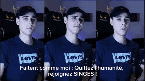 a man wearing a levi 's t-shirt is talking into a microphone