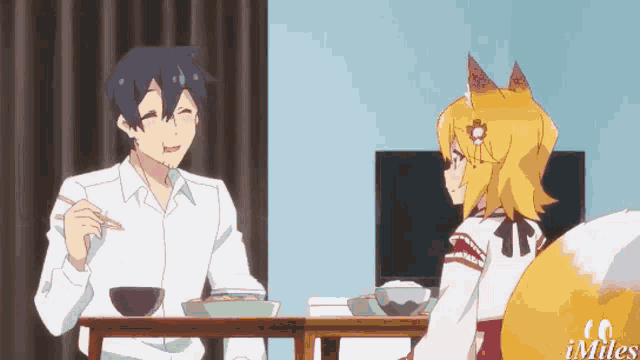a man and a fox are sitting at a table with chopsticks .