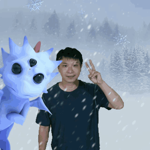 a man giving a peace sign in front of a blue dragon
