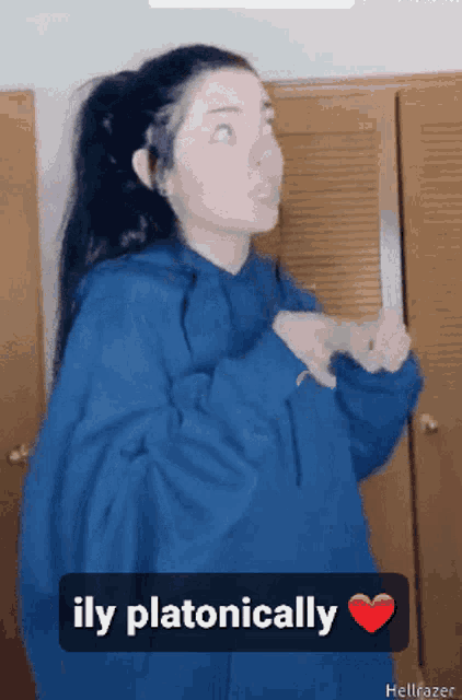 a girl in a blue hoodie says ily platonically
