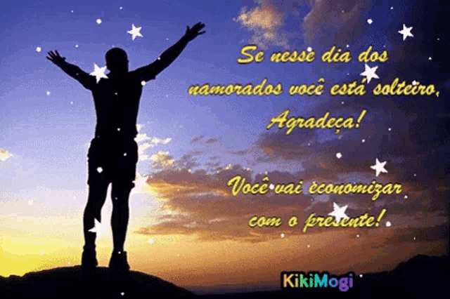 a silhouette of a man standing on top of a hill with his arms up