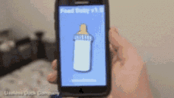 a person is holding a cell phone with a picture of a bottle on the screen